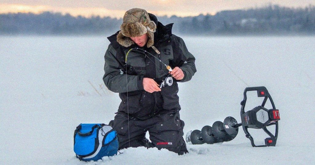 Man ice fishing with bib on