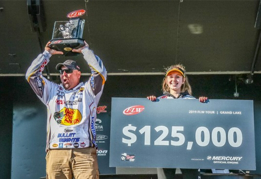 When Jeremy Lawyer celebrates victories in pro bass fishing, his daughter Abbey is often on stage to help him. (Photo by Kyle Wood/Major League Fishing)